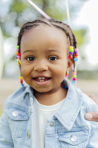 Cute little girl with braided hair at park