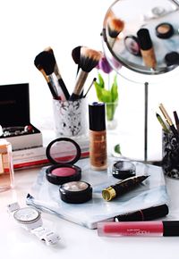 Close-up of make-up products on table