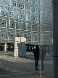 Woman standing in city