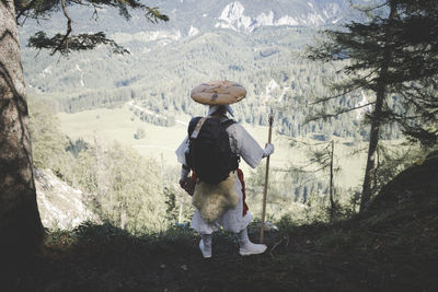 Full length rear view of man walking on land