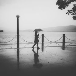 Silhouette of woman in sea