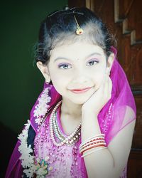 Portrait of smiling girl standing outdoors