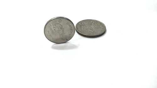 High angle view of coins on white background