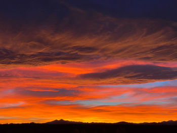 Low angle view of dramatic sky during sunset