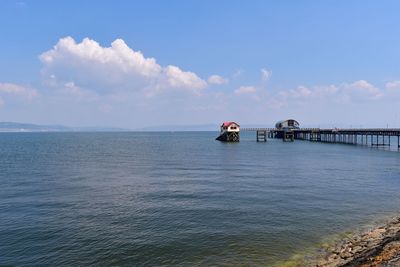 Pier over sea against sky