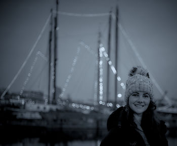 Portrait of smiling young woman in illuminated hat