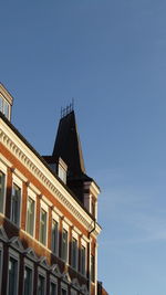 Low angle view of building against blue sky