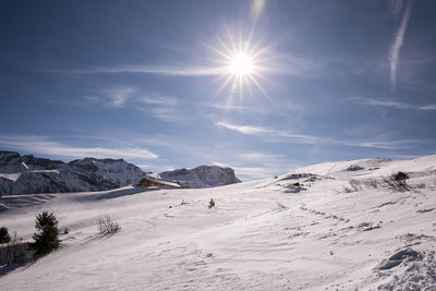 Scenic view of snowcapped mountains against sky