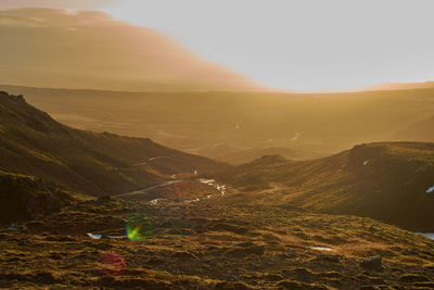 Scenic view of landscape against sky during sunset