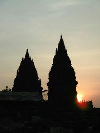 Built structure against sky at sunset