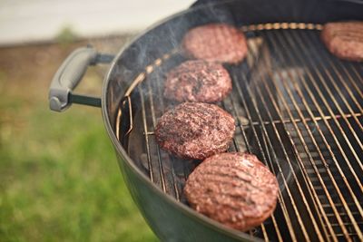 High angle view of meat on barbecue grill