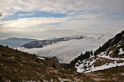 Scenic view of snowcapped mountains against sky