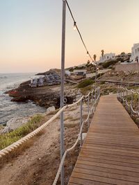 Scenic view of sea against clear sky during sunset