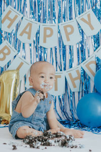 High angle view of cute girl playing with toys on table