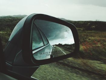 Cropped image of car on road