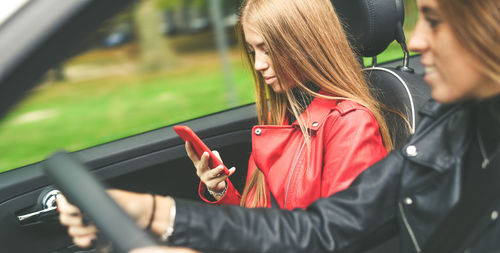 Young woman using mobile phone