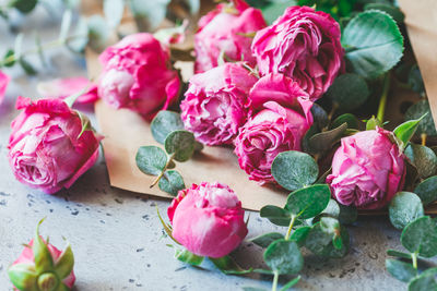 Close-up of flowers in envelope on table