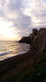 Scenic view of sea against sky at sunset