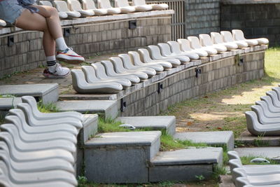 Low section of woman sitting on steps