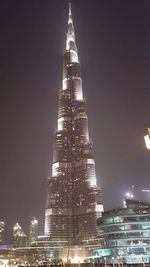 Low angle view of illuminated city at night