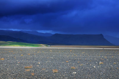 Scenic view of landscape against blue sky