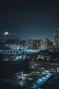 Illuminated buildings in city at night