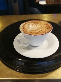 Close-up of coffee cup on table