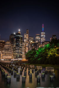 Illuminated buildings in city at night