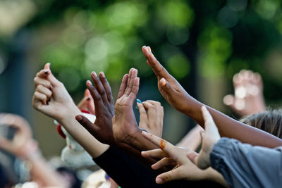 Cropped hands of people