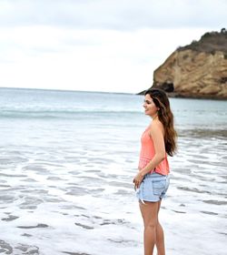 Woman standing on beach