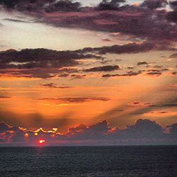 Scenic view of sea at sunset