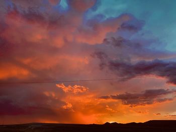 Low angle view of dramatic sky during sunset
