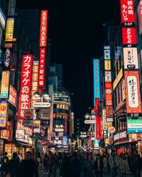 Crowd on city street at night