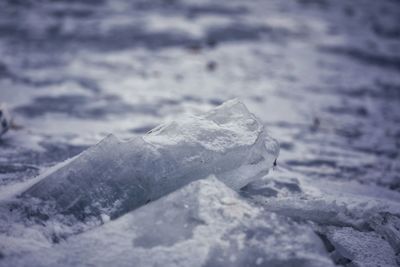 Close-up of frozen sea against sky