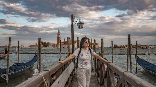 Low angle view of people on pier