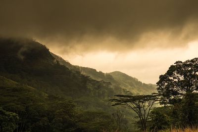 Scenic view of mountain against dramatic sky