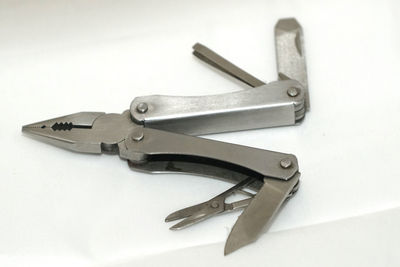 High angle view of piano on table against white background