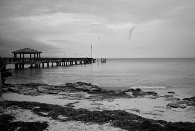 Pier over sea against sky