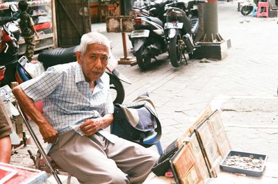 Man working on street in city