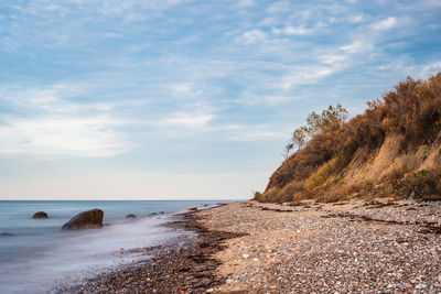 Scenic view of beach against sky