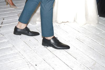 Low section of people standing on footpath