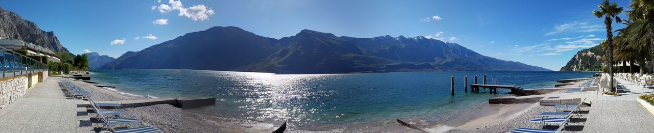 Panoramic view of sea and mountains against sky