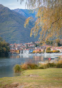 Scenic view of lake by buildings in city