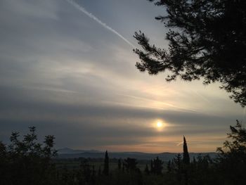 Scenic view of landscape against sky at sunset