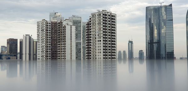 Modern buildings in city against sky