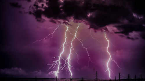 Low angle view of lightning against dramatic sky