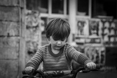 Cute boy riding bicycle