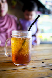 Close-up of drink in glass jar on table