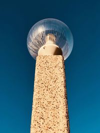 Low angle view of tower against clear blue sky