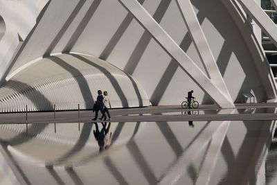 Man walking on bridge